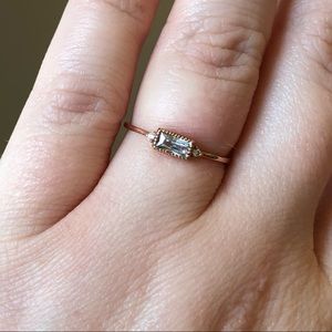 Rose Gold colored ring with baguette cut stone